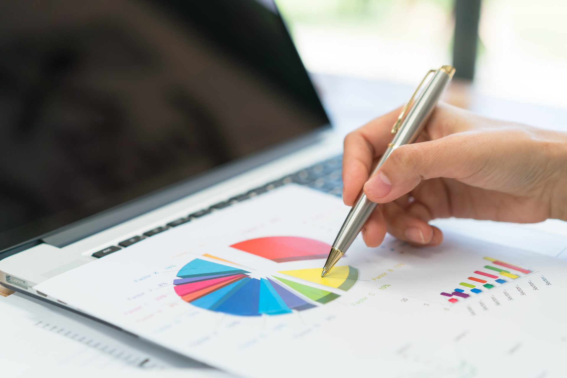 business-people-using-laptop-financial-charts-meeting-office